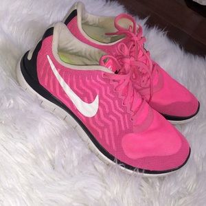 Pink Nike running shoes